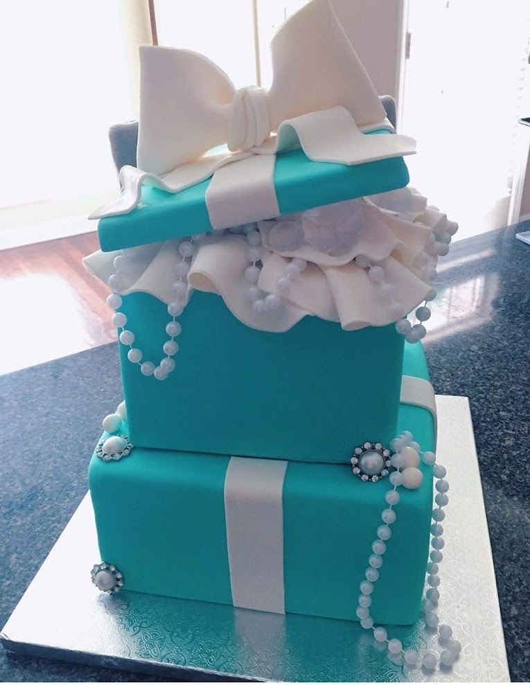 Tiffany blue tiered box cake with pearl necklace draping and white bow