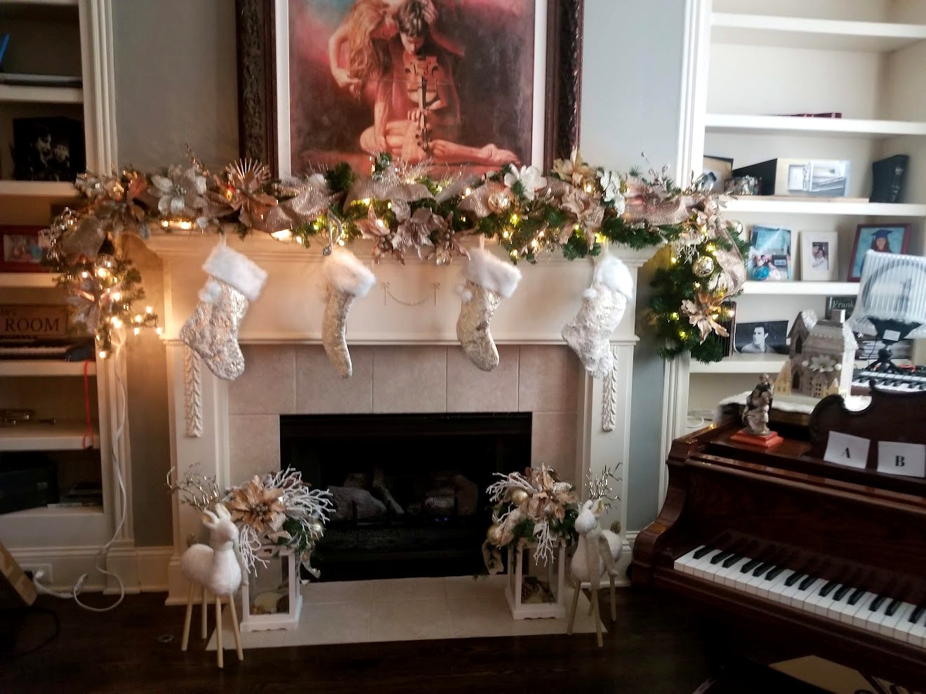 Elegant white and gold fireplace mantel with piano